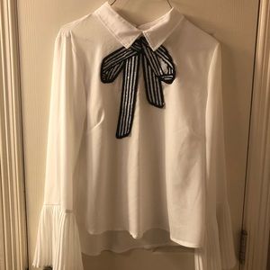 White blouse with ruffled sleeves